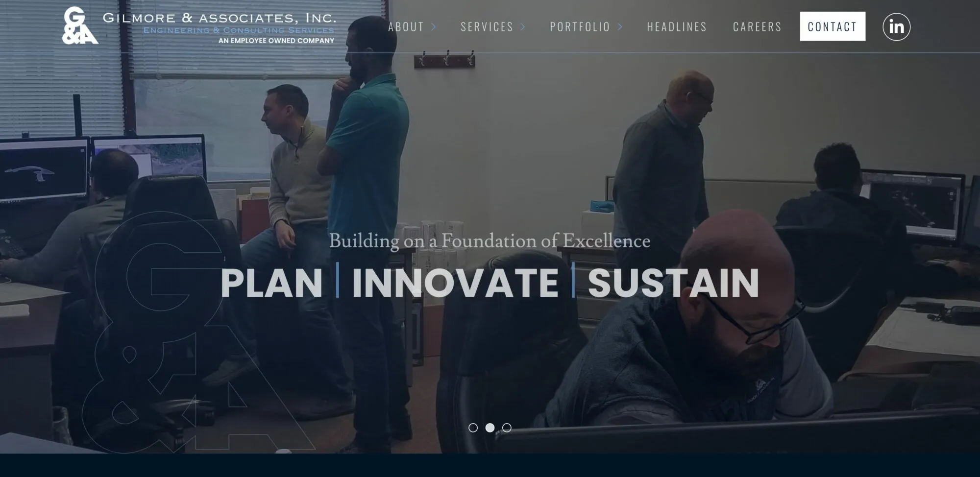 Gilmore & Associates homepage: engineers working at CAD workstations in a dimmed office photo behind the tagline “Plan | Innovate | Sustain”