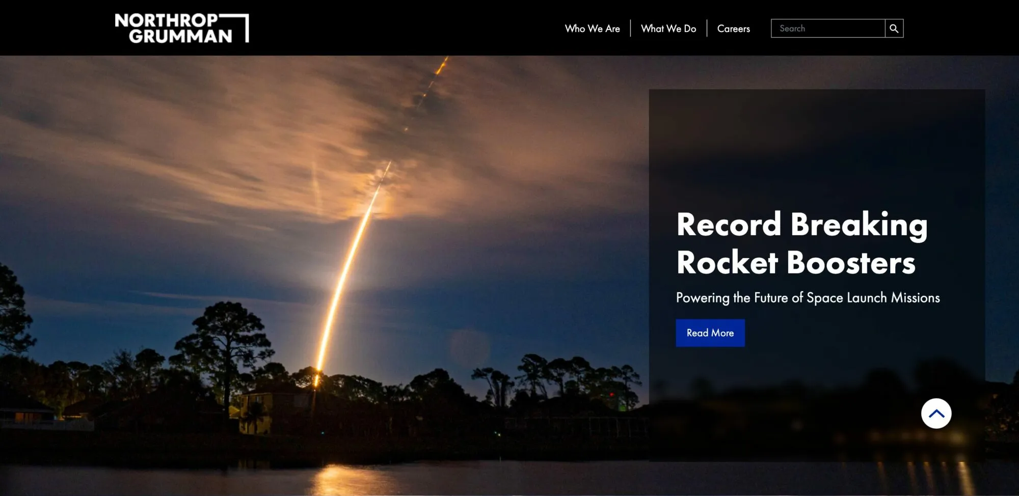 Northrop Grumman homepage: night-time rocket launch streaking over a treeline with the headline “Record Breaking Rocket Boosters”