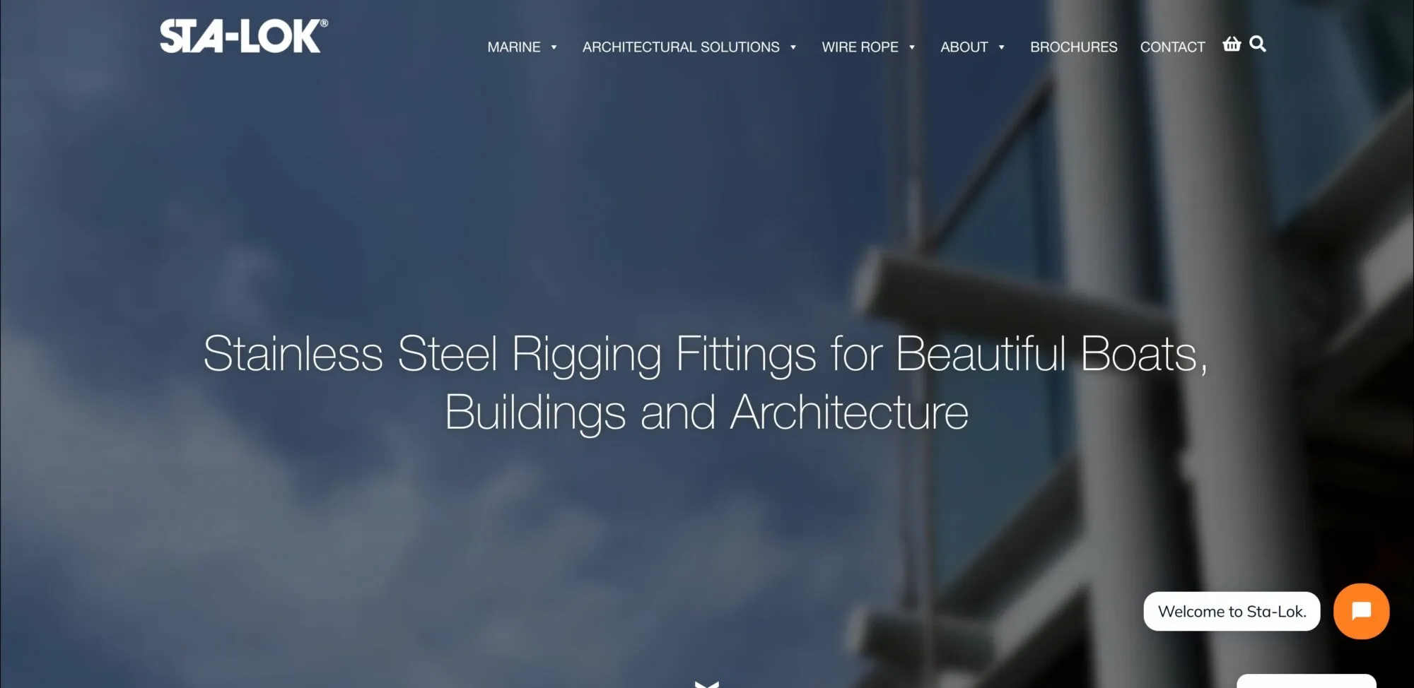 Sta-Lok homepage: full-screen photo of steel rigging against the sky with the headline “Stainless Steel Rigging Fittings for Beautiful Boats, Buildings and Architecture”